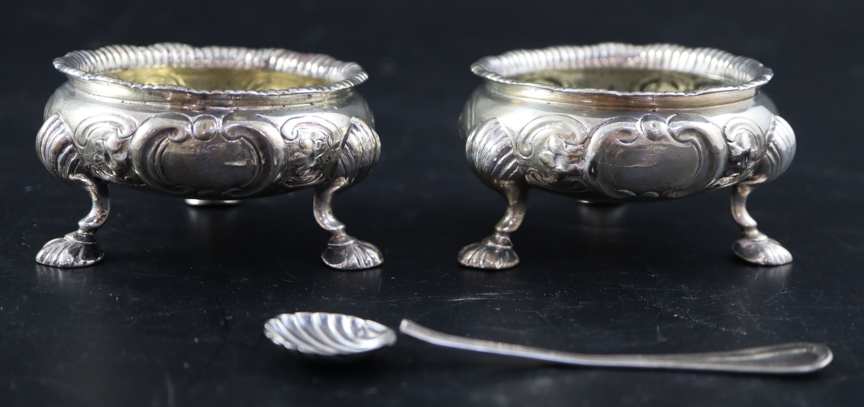 A pair of Victorian embossed silver bun salts, 8.5oz.
